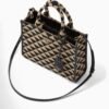 Symbole embroidered fabric handbag