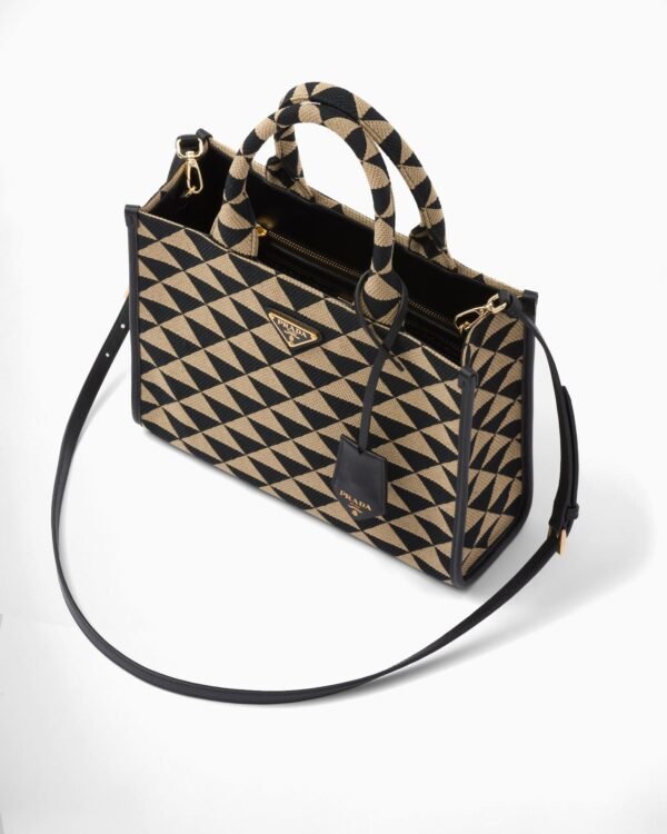 Symbole embroidered fabric handbag