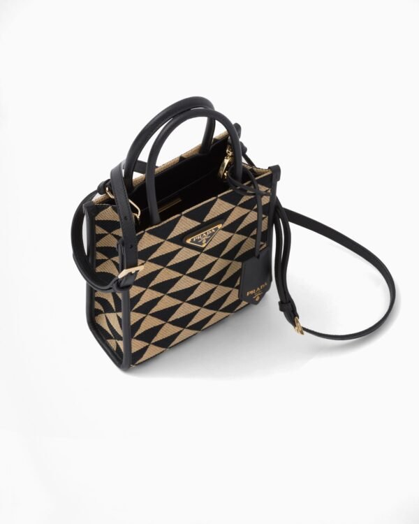 Symbole embroidered fabric mini bag