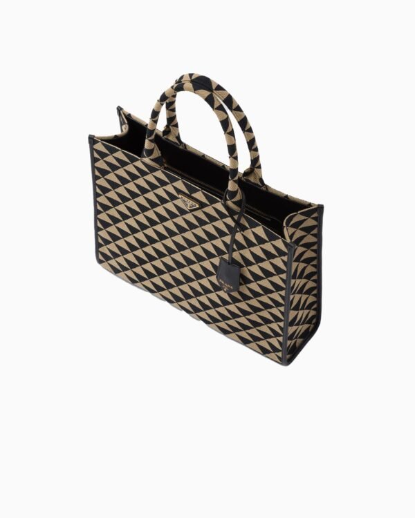 Symbole embroidered fabric handbag