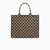 Symbole embroidered fabric handbag
