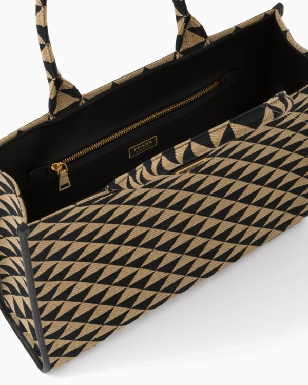 Symbole embroidered fabric handbag