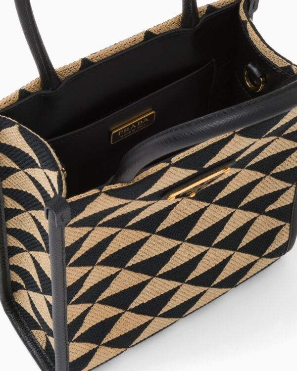 Symbole embroidered fabric mini bag