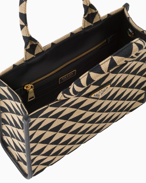 Symbole embroidered fabric handbag