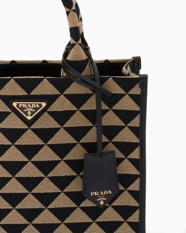 Symbole embroidered fabric handbag