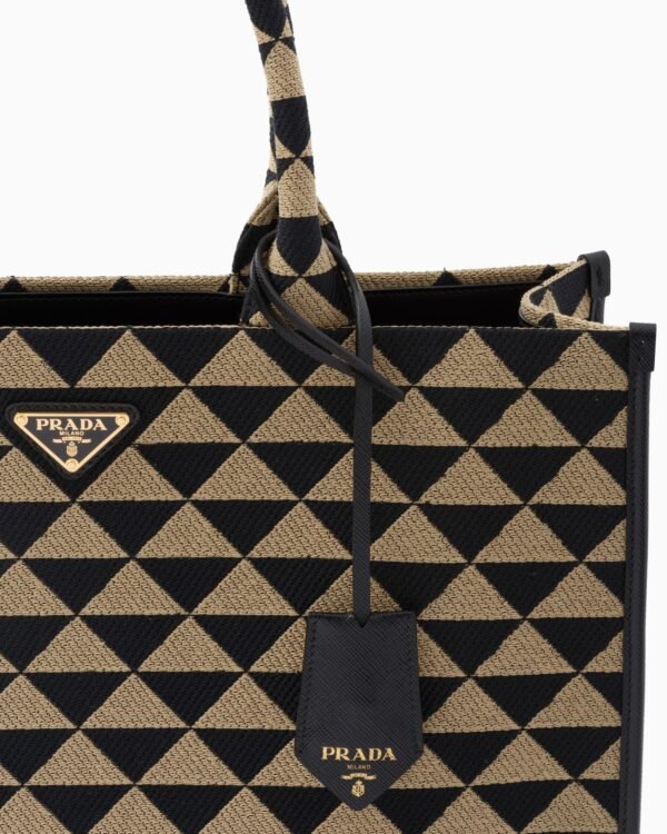 Symbole embroidered fabric handbag