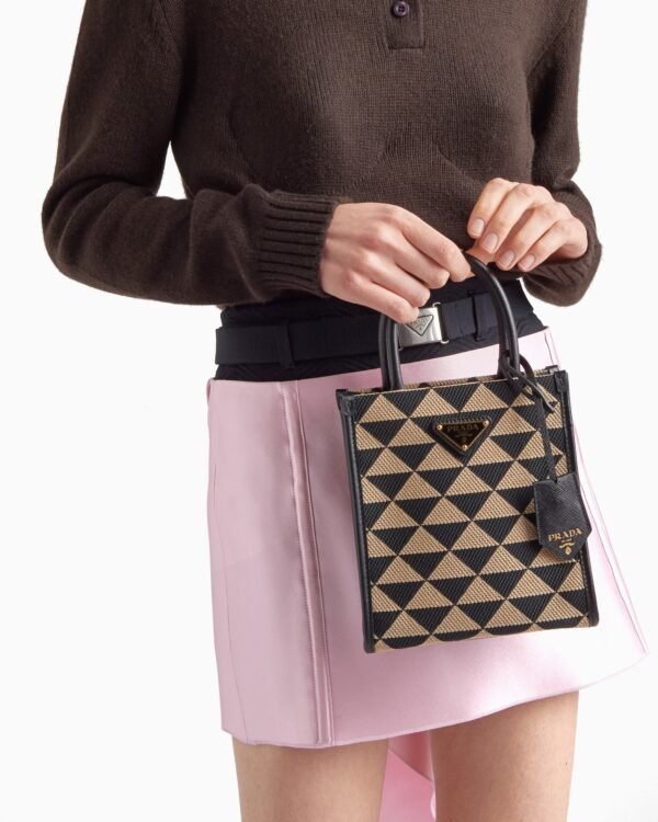 Symbole embroidered fabric mini bag
