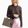 Symbole embroidered fabric handbag