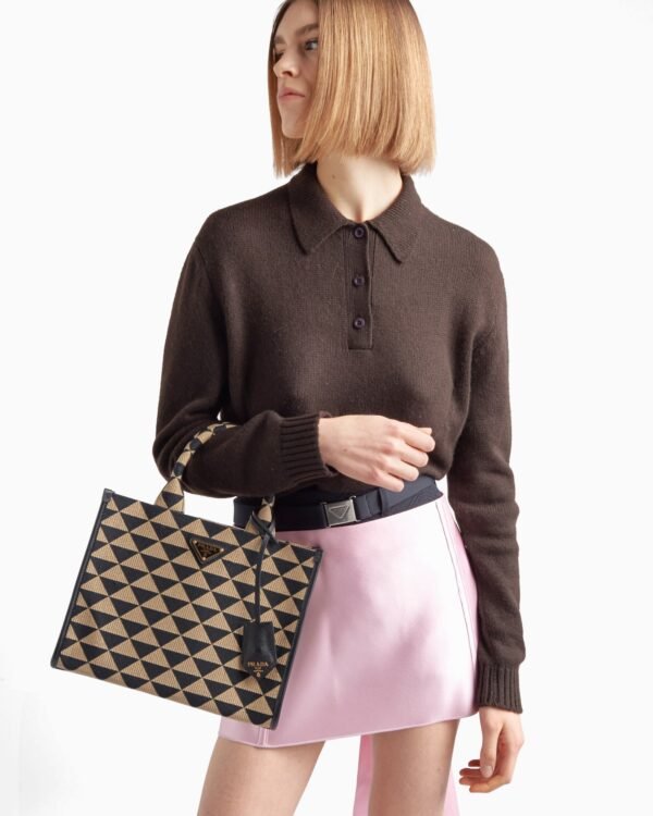 Symbole embroidered fabric handbag
