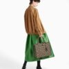 Symbole embroidered fabric handbag
