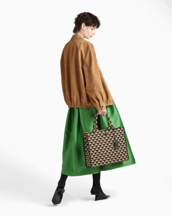 Symbole embroidered fabric handbag